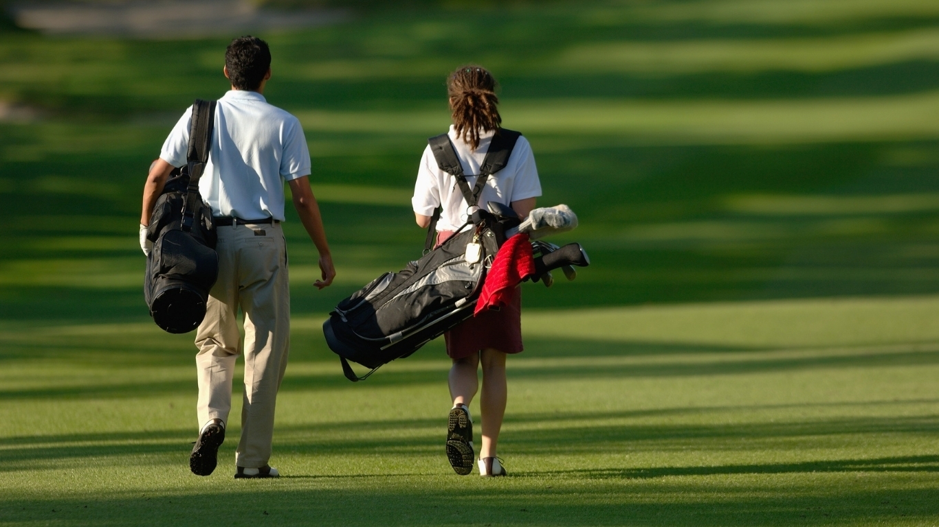 Junior golfers playing on course Spokane youth golf program